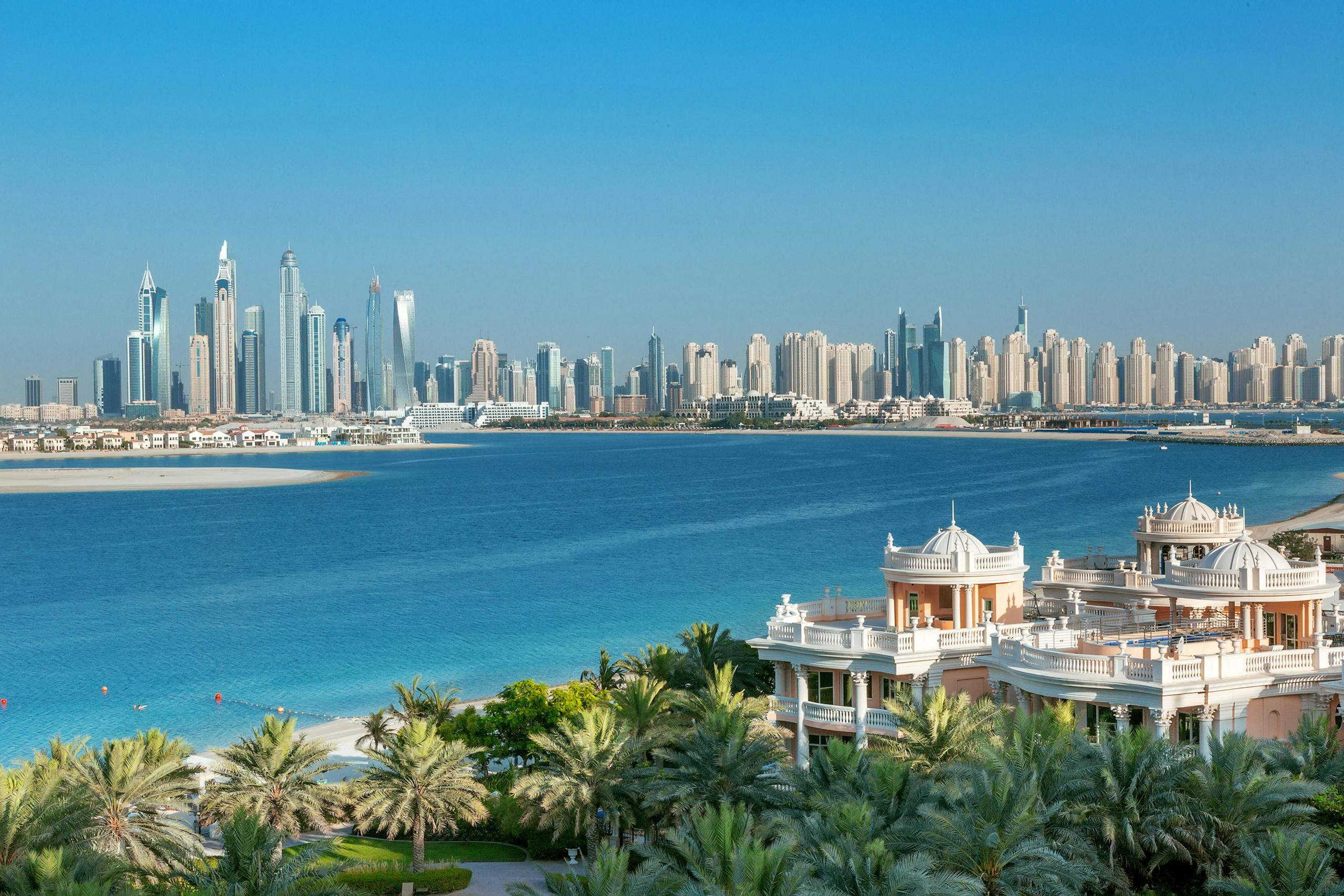 Breathtaking view of Dubai skyline and Palm Jumeirah, showcasing luxury beachfront architecture.